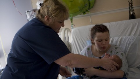 Nurse, new mom and baby.